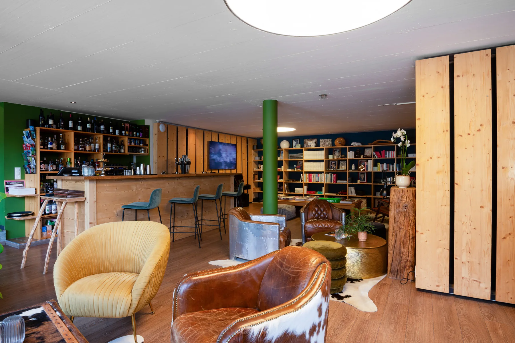 The Café Littéraire by day, the bar and the shelves behind it