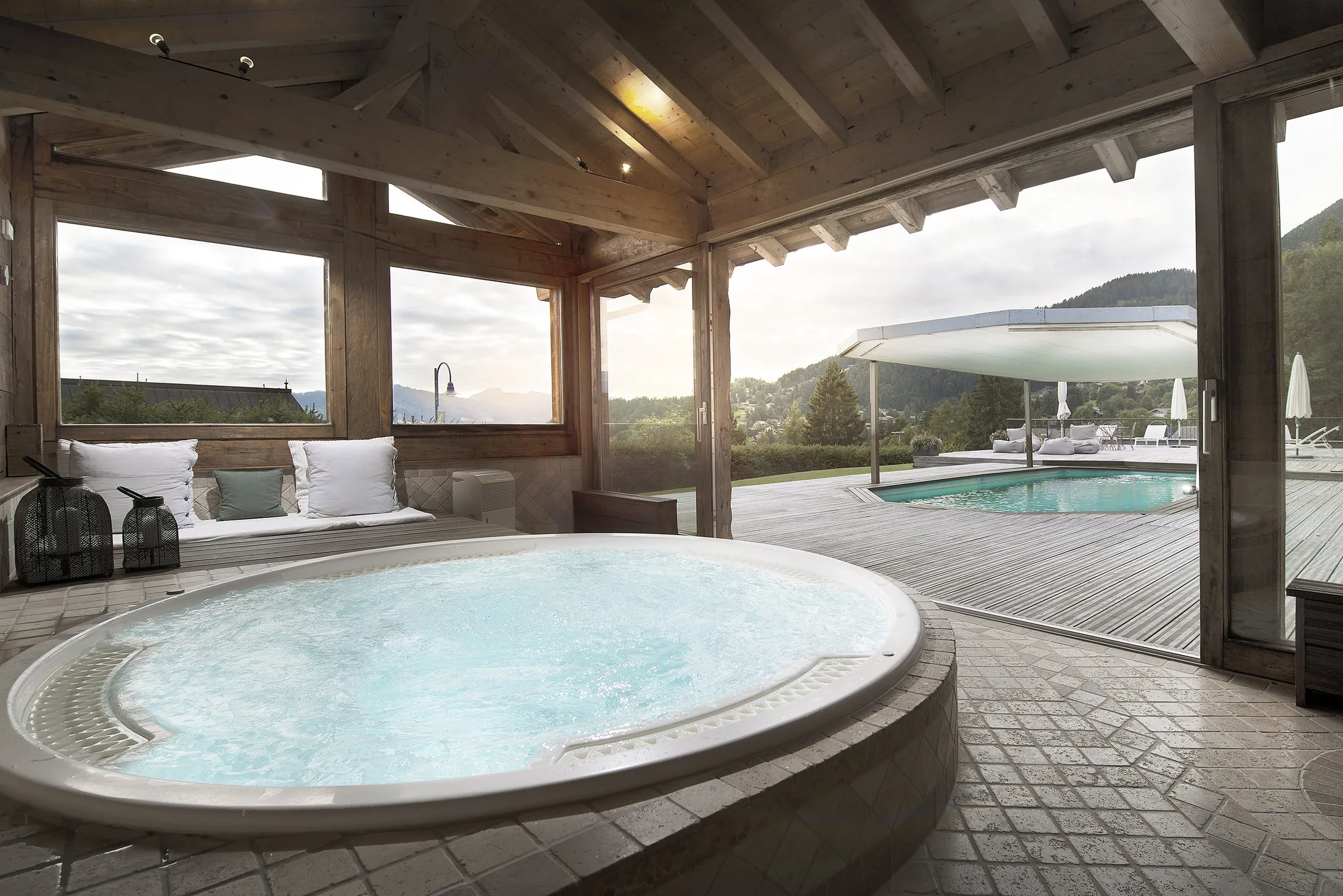 The private jacuzzi and heated pool at Les Mazots du Clos