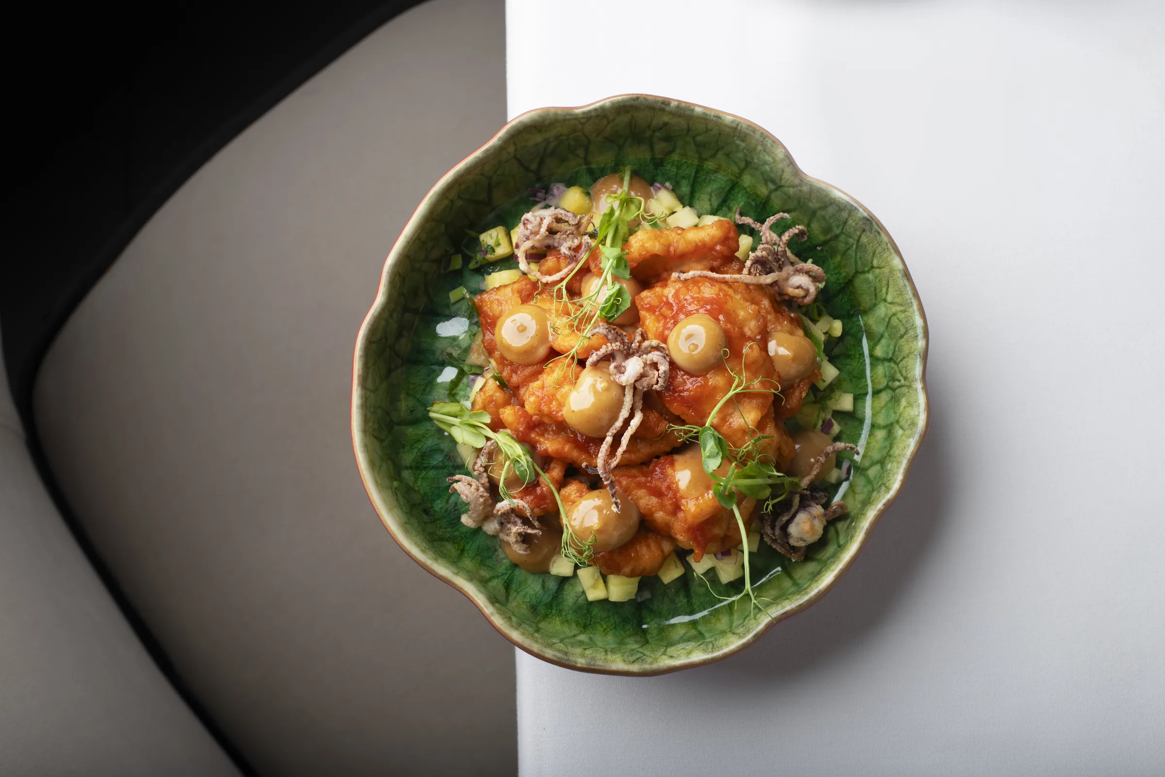 Crisp squid in a green scalloped bowl at Saskia's